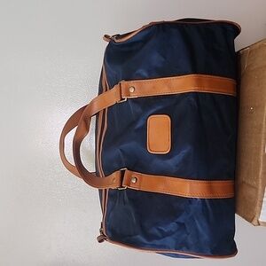 Walt Disney travel Co Inc. Brown leather handles with blue vinyl weekender bag